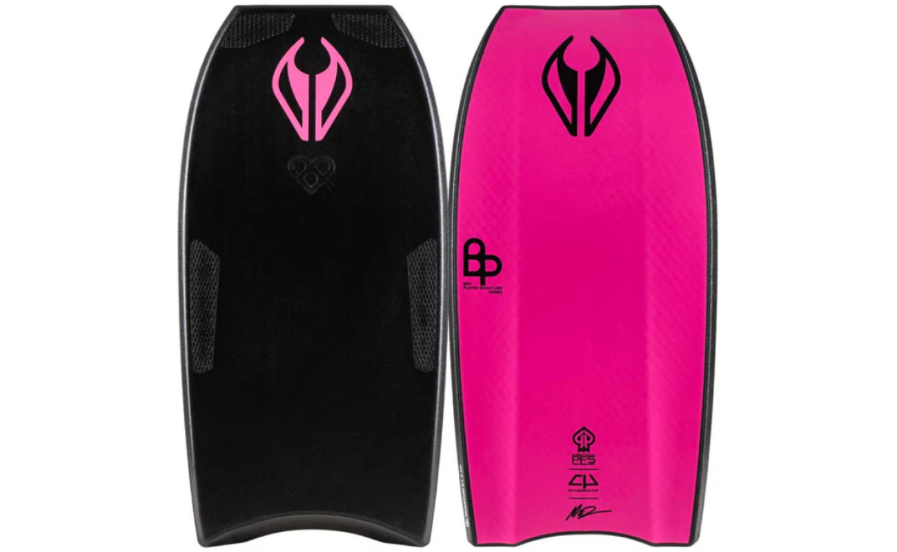 Two bodyboards side by side, one black with pink logo and textured pads and one bright pink with black logos and quad tail